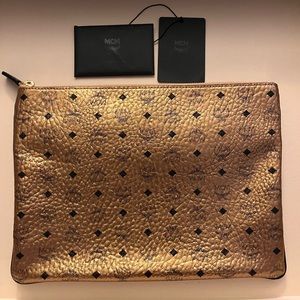 Gold Metallic MCM clutch